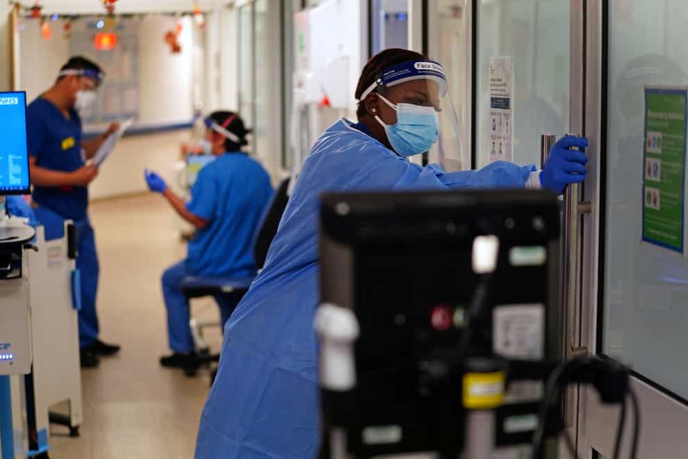 Medical staff wearing PPE on a ward for Covid-19 patients at King’s College Hospital in south-east London (Victoria Jones/PA)