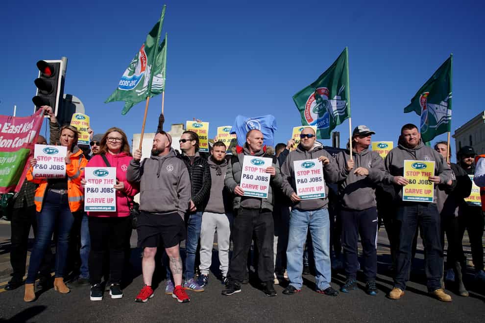 Former P&O staff and RMT members block the road leading to the Port of Dover as P&O Ferries suspended sailings and handed 800 seafarers immediate severance notices, saying: “Our survival is dependent on making swift and significant changes.” Picture date: Thursday March 17, 2022. (Gareth Fuller/PA)