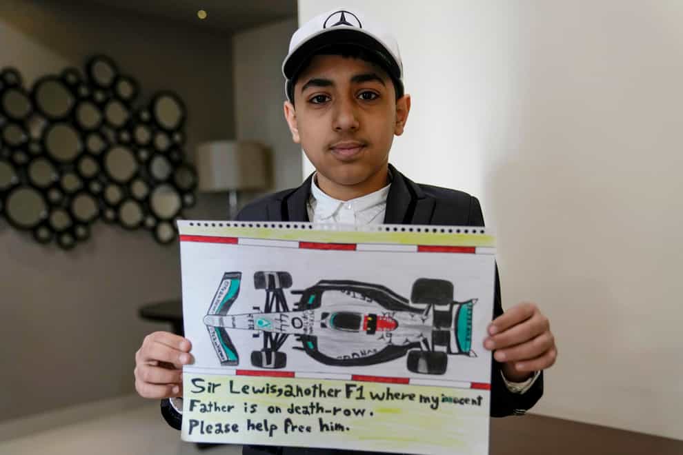 Ahmed shows off the drawing he sent to Lewis Hamilton (AP Photo)