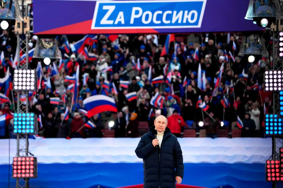 Vladimir Putin delivers his speech at the concert marking the eighth anniversary of the annexation of the Crimea (Alexander Vilf/Sputnik Pool Photo via AP)