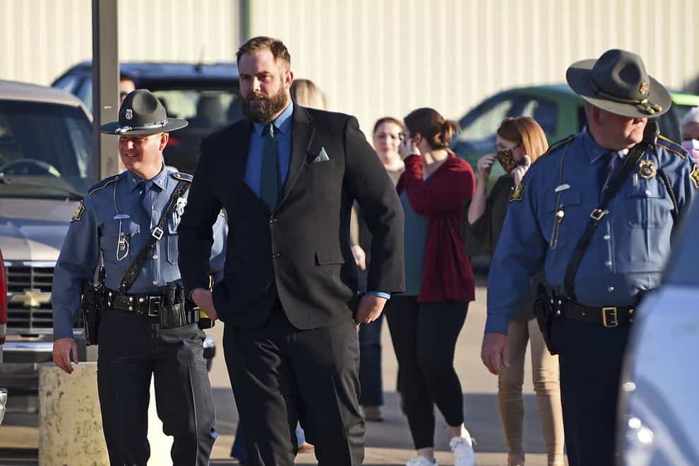 Former deputy Michael Davis is escorted into court by Arkansas state troopers (Thomas Metthe/The Arkansas Democrat-Gazette via AP)