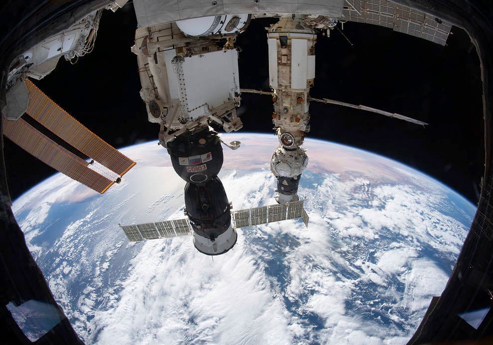 The International Space Station orbits 264 miles above the Tyrrhenian Sea with the Soyuz MS-19 crew ship docked (NASA via AP)