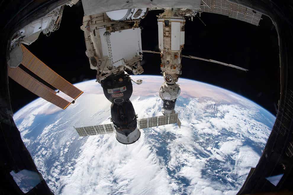 The International Space Station orbits 264 miles above the Tyrrhenian Sea with the Soyuz MS-19 crew ship docked (NASA via AP)