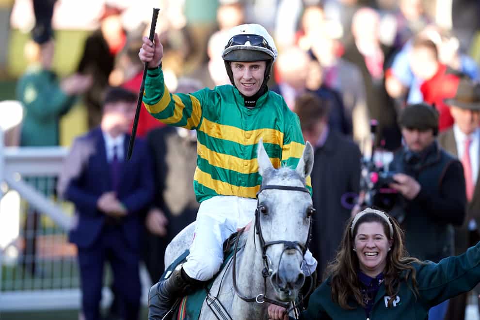 Jockey Mark celebrates with horse Mark Walsh after winning the Mrs Paddy Power Mares’ Chase during day four of the Cheltenham Festival at Cheltenham Racecourse. Picture date: Friday March 18, 2022.