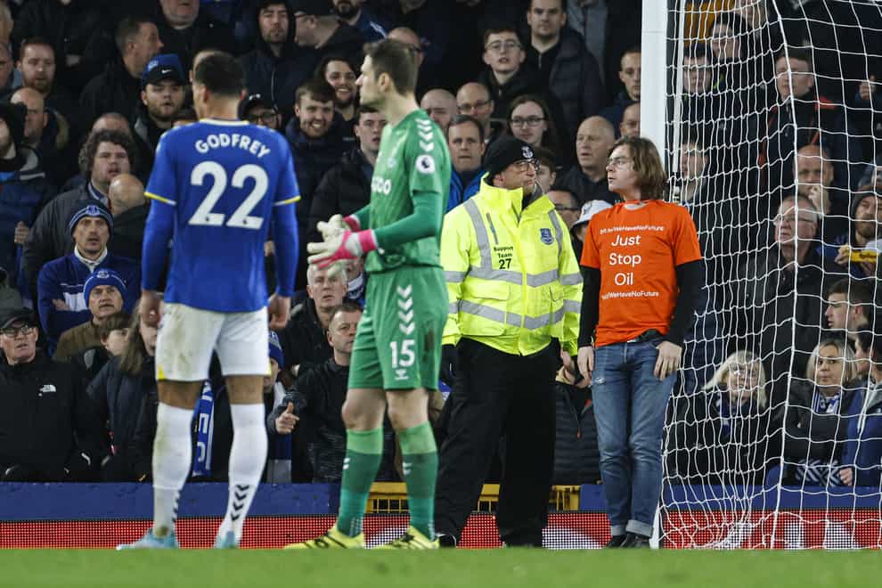 A protester tied himself to a goalpost during Everton’s win over Newcastle (Richard Sellers/PA).