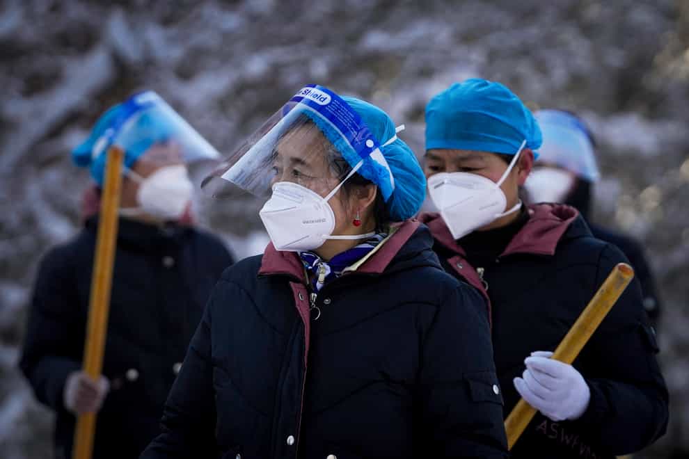 China’s health authorities reported the country’s first Covid-19 deaths since January 2021 as infections surge due to the Omicron variant (Andy Wong/AP)