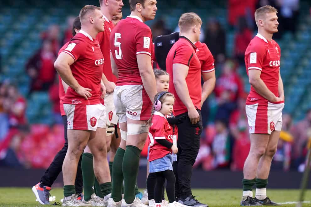 Wales players stand dejected at the final whistle after losing to Italy (Mike Egerton/PA)