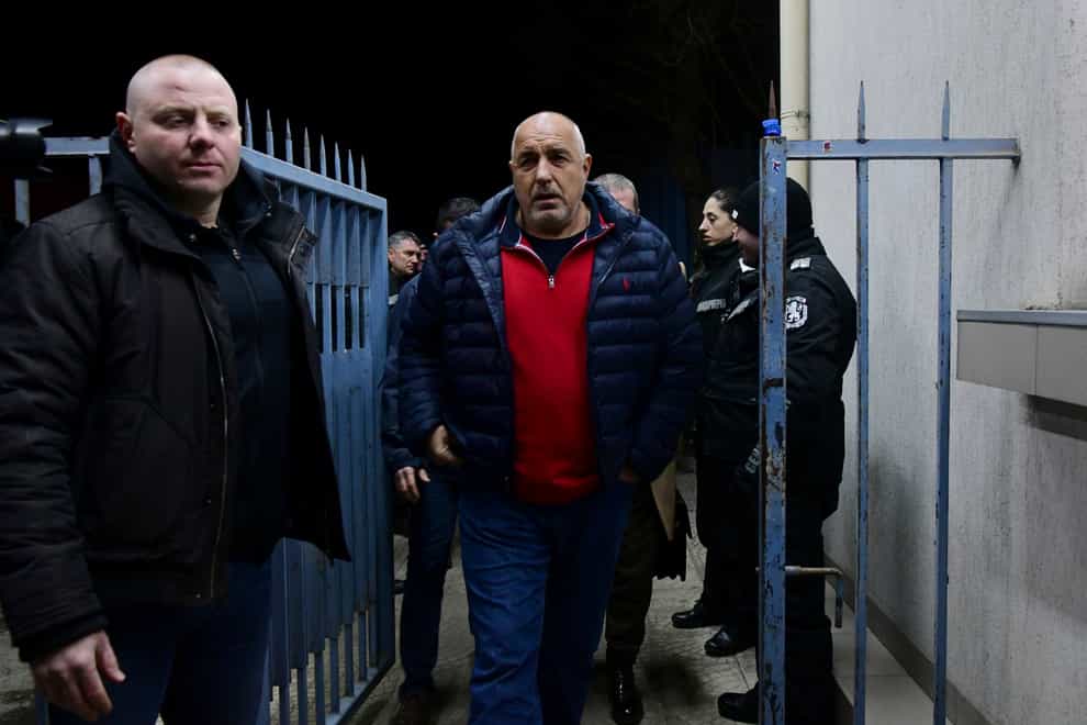 Boyko Borissov walks out of the police department in Sofia where he was detained for 24 hours (Milena Stoykova/Bulfoto via AP)
