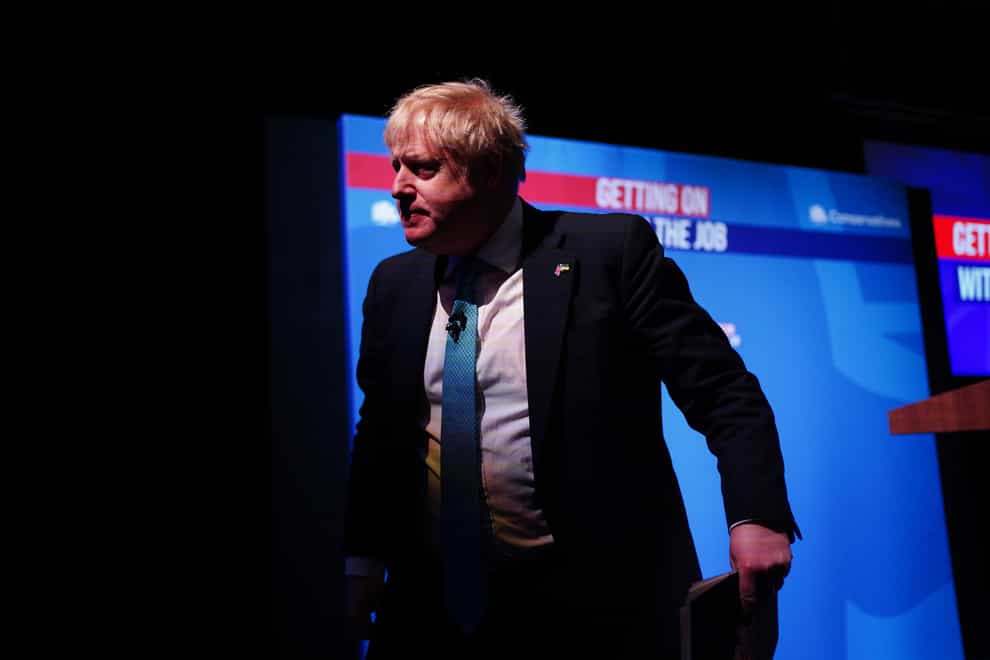 Prime Minister Boris Johnson leaves the stage after making his speech (Peter Byrne/PA)