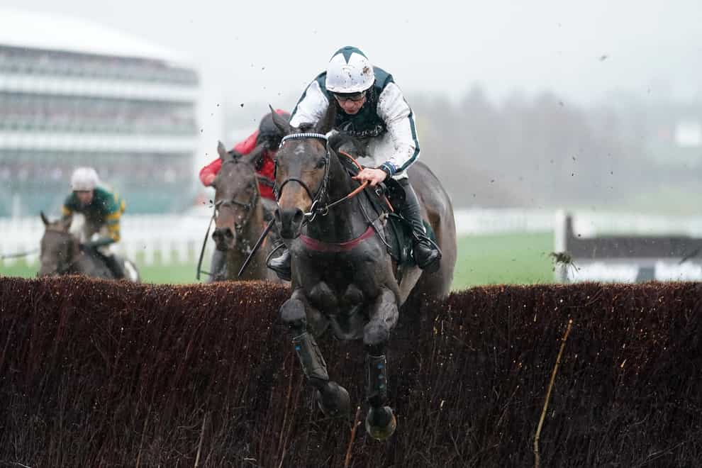 L’Homme Presse and Charlie Deutsch on their way to winning the Brown Advisory Novices’ Chase (David Davies/PA)