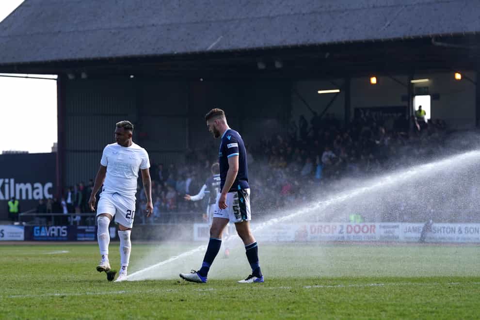 A sprinkler turns on mid match between Dundee and Rangers (Andrew Milligan/PA)