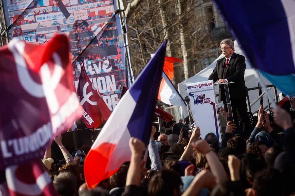 French far-left candidate for the upcoming presidential election Jean-Luc Melenchon delivers a speech after a march in Paris (Thomas Padilla/AP)