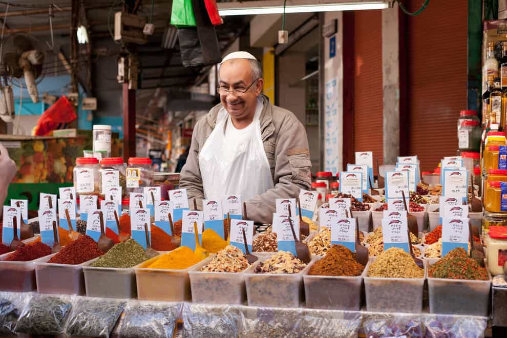 A spice vendor in Tel Aviv (Alamy/PA)
