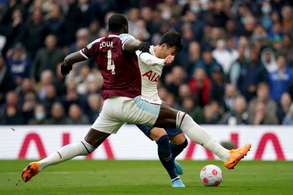 Kurt Zouma, left, challenges Son Heung-min during Tottenham’s win over West Ham (Nick Potts/PA)
