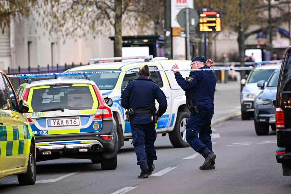 Police officers attend the scene at a school in Malmo (Johan Nilsson/TT via AP)