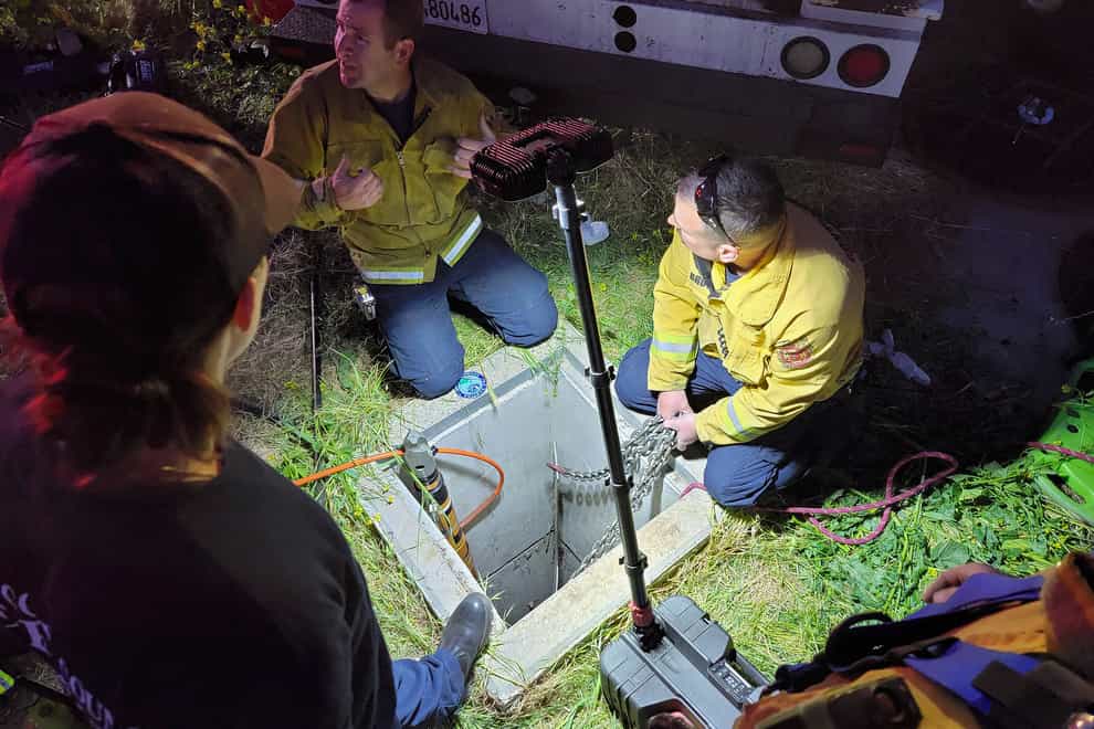 Emergency crews ponder how to reach the trapped man (Steve Hill/Contra Costa County Fire Protection District via AP)