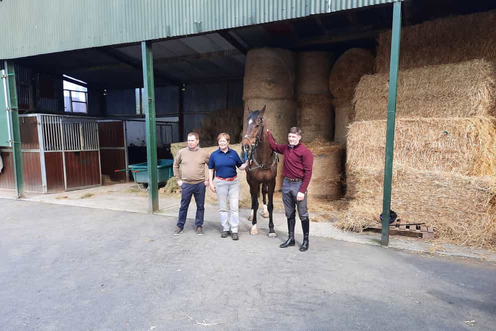 Last year’s Irish Grand National winner Freewheelin Dylan with trainer Dermot McLoughlin (left) and jockey Ricky Doyle (right) (PA)