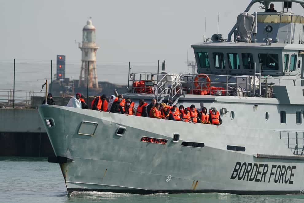 A group of people thought to be migrants are brought in to Dover, Kent, onboard a Border Force vessel following a small boat incident in the Channel. Picture date: Tuesday March 22, 2022. (Gareth Fuller/PA)