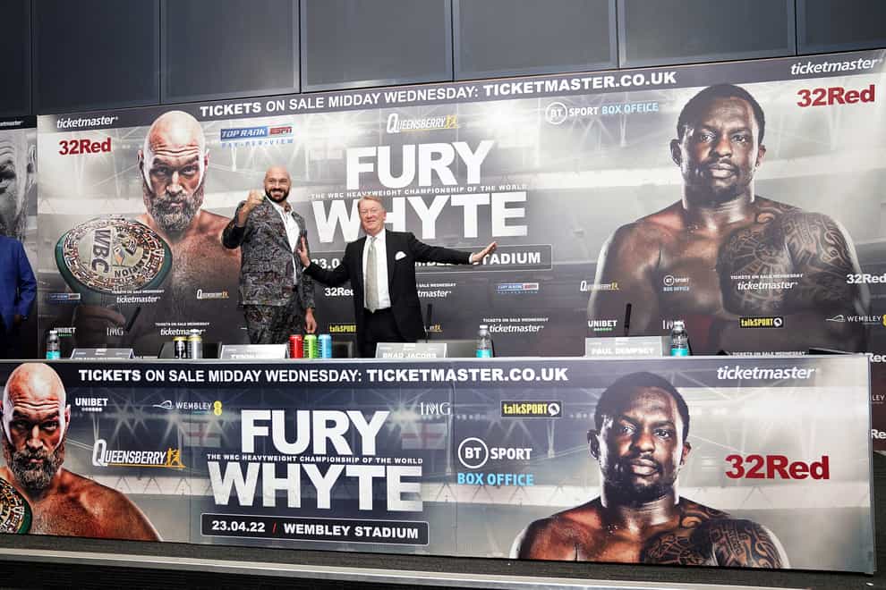 Promoter Frank Warren and Tyson Fury mock a face-off in the absence of Dillian Whyte (John Walton/PA)