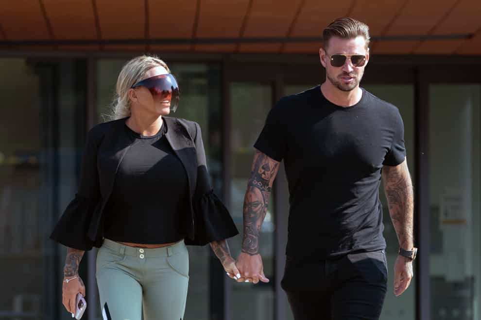 Carl Woods leaves at Colchester Magistrates’ Court, Essex, alongside partner Katie Price, after appearing charged under Section 4 of the Public Order Act (Joe Giddens/PA)