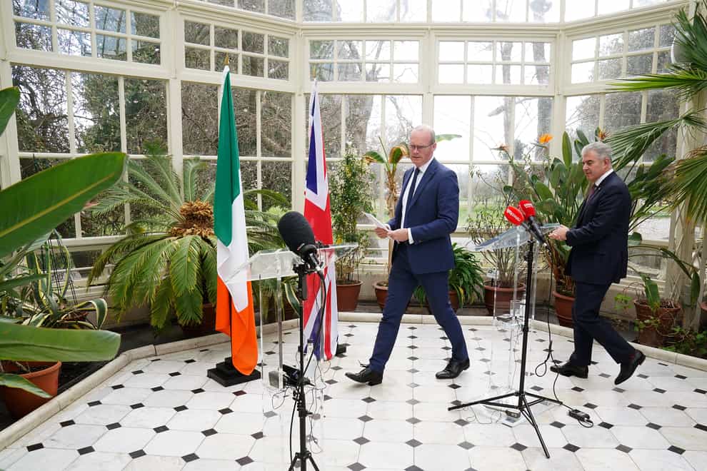 Ireland’s Foreign Affairs minister Simon Coveney (left) and Northern Ireland Secretary Brandon Lewis arrive at a press conference (Brian Lawless/PA)