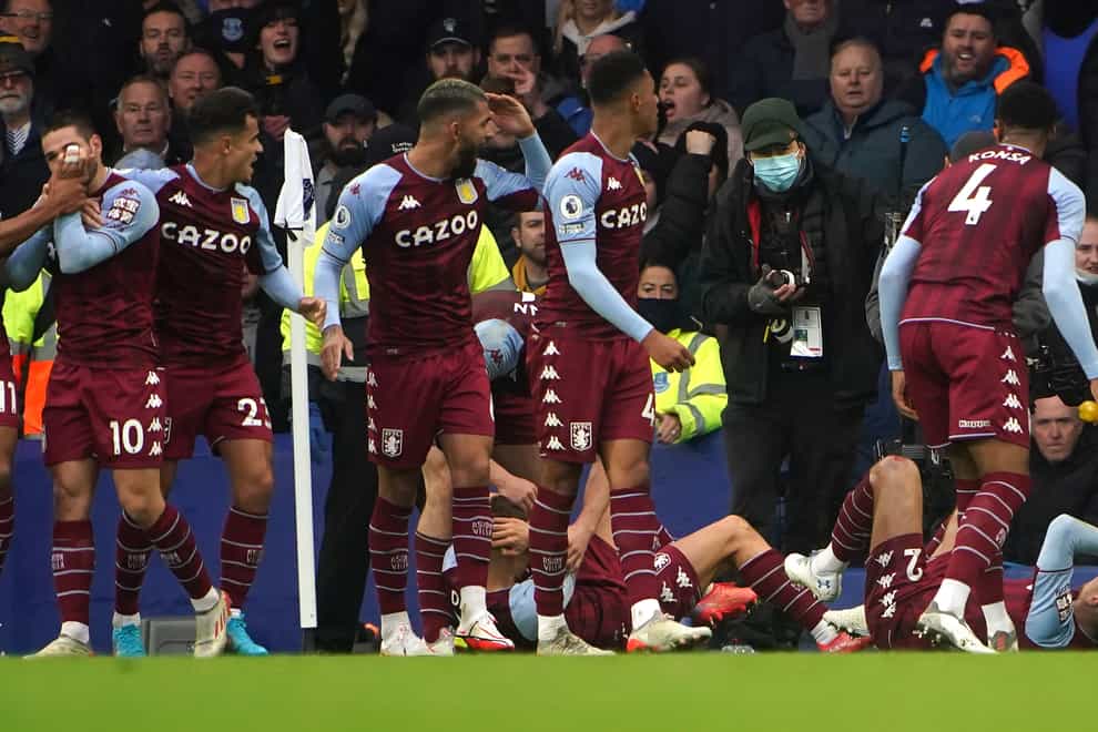 Aston Villa’s Lucas Digne and Matty Cash react to a missile being thrown during a Premier League match at Goodison Park (PA)
