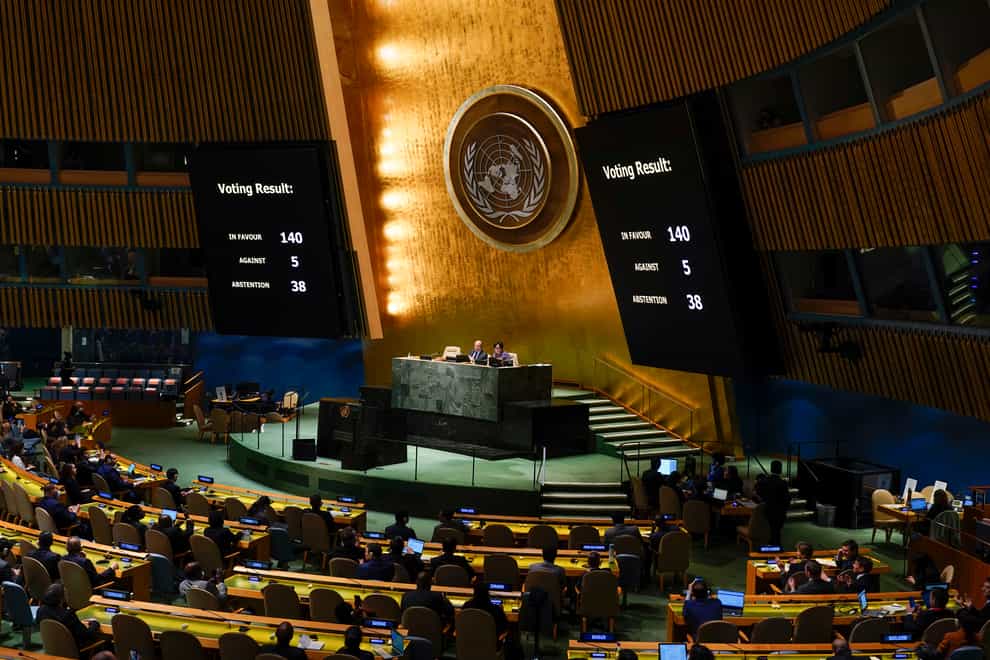 Screens display the results of a vote on a resolution regarding the war in Ukraine (Seth Wenig/AP)