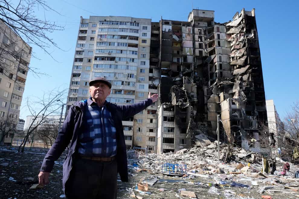 A man points to his destroyed home following a Russian bombardment in Kharkiv (Efrem Lukatsky/AP)