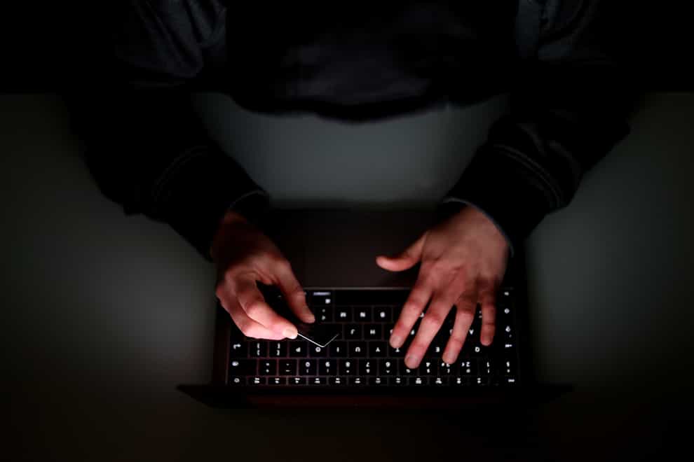 File photo of someone using a laptop. (Tim Goode/PA)
