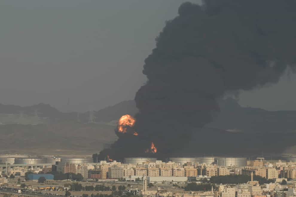 A cloud of smoke rises from a burning oil depot in Jiddah (Hassan Ammar/AP)