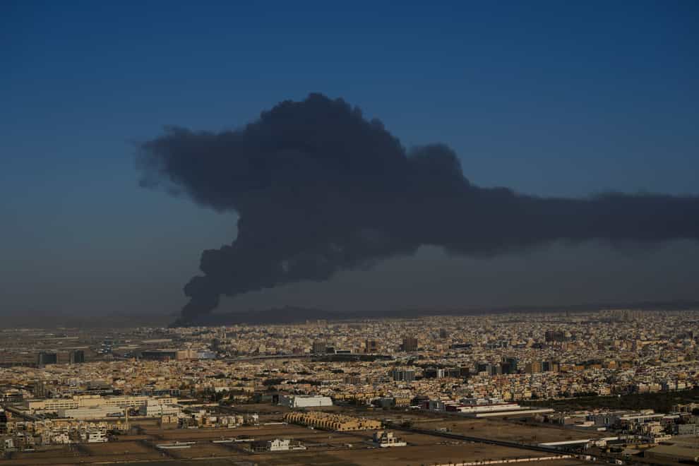 A huge cloud of smoke rises from a burning oil depot in Jiddah (Hassan Ammar/AP)