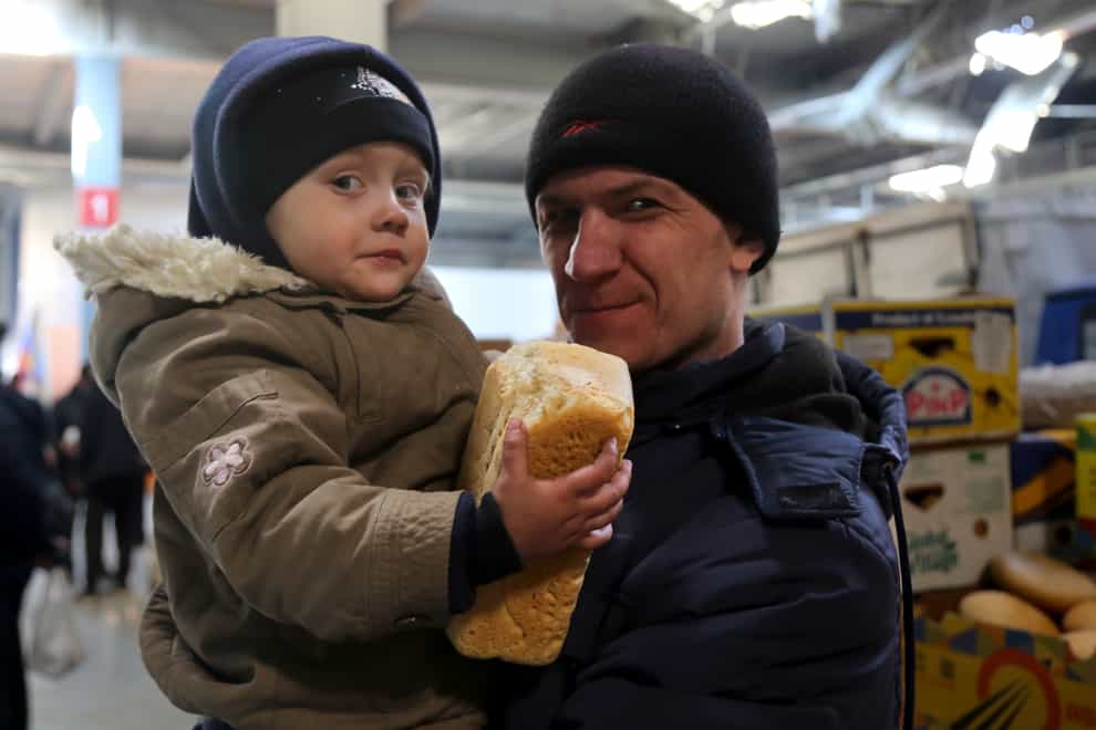 The UK is providing £2 million of food supplies to parts of Ukraine encircled by Russian forces (Alexei Alexandrov/AP)