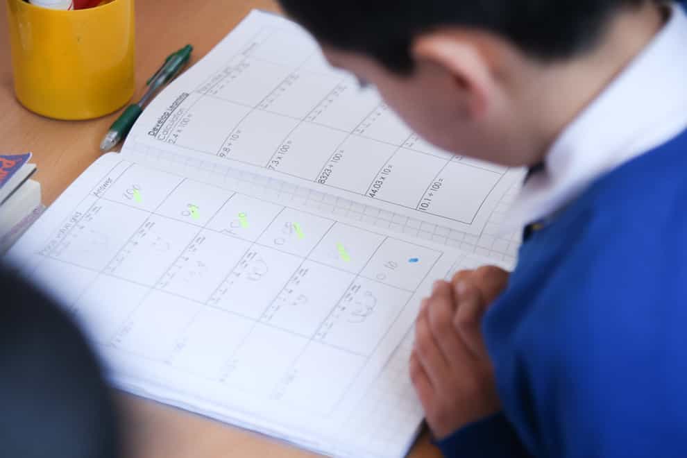 90% of pupils leaving primary school will need to meet expected standards in literacy and numeracy (PA)
