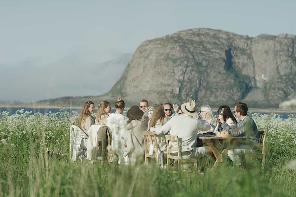 Guests gather for lunch at a summerhouse in Norway (62 Nord/PA)