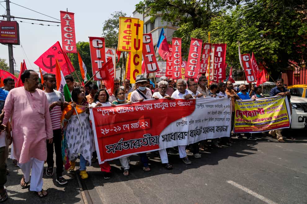 Protesters take to the streets in India on a day of industrial action to demand more rights (AP Photo/Bikas Das)