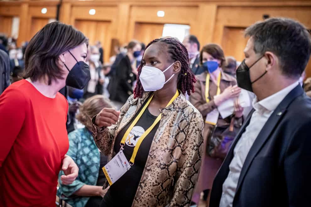 Hilda Nakabuye, centre, a Fridays for Future activist from Uganda, talks with Annalena Baerbock, German foreign minister, and Robert Habeck, federal minister for economic affairs and climate protection (dpa via AP)
