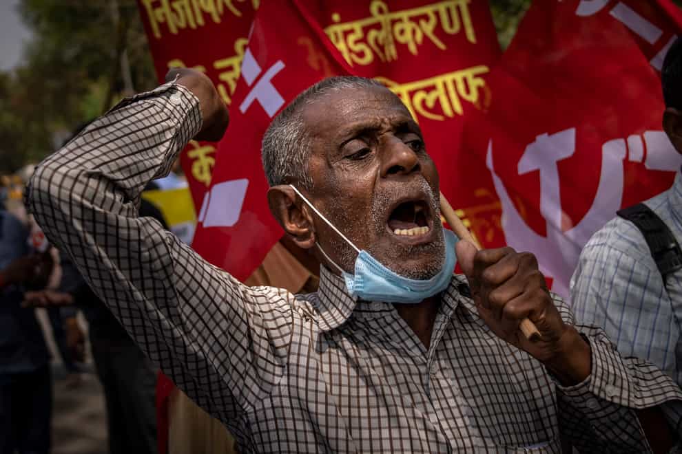 A protestor shouts slogans during a march in support (AP)