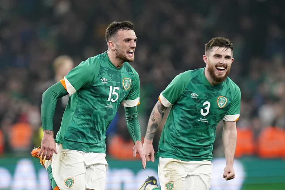 Republic of Ireland striker Troy Parrott (left) celebrates his winner against Lithuania with team-mate Ryan Manning (Niall Carson/PA)