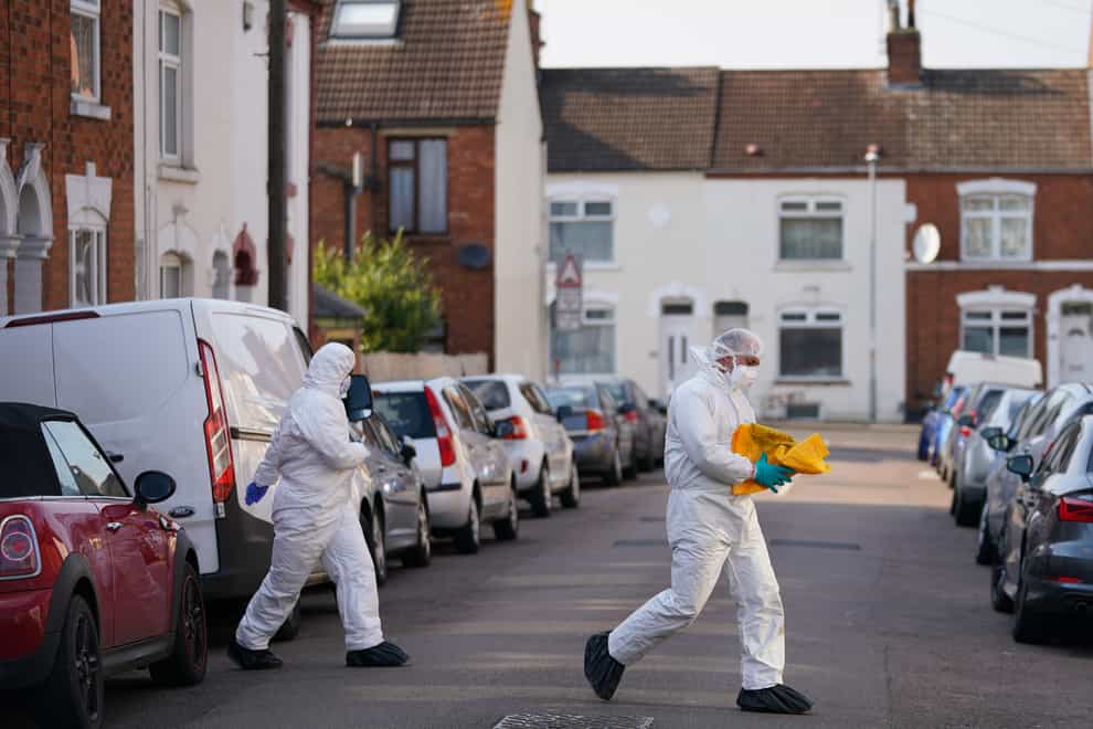 Forensic officers at the scene in Moore Street, Northampton, following a discovery of a body in the garden (Jacob King/PA)