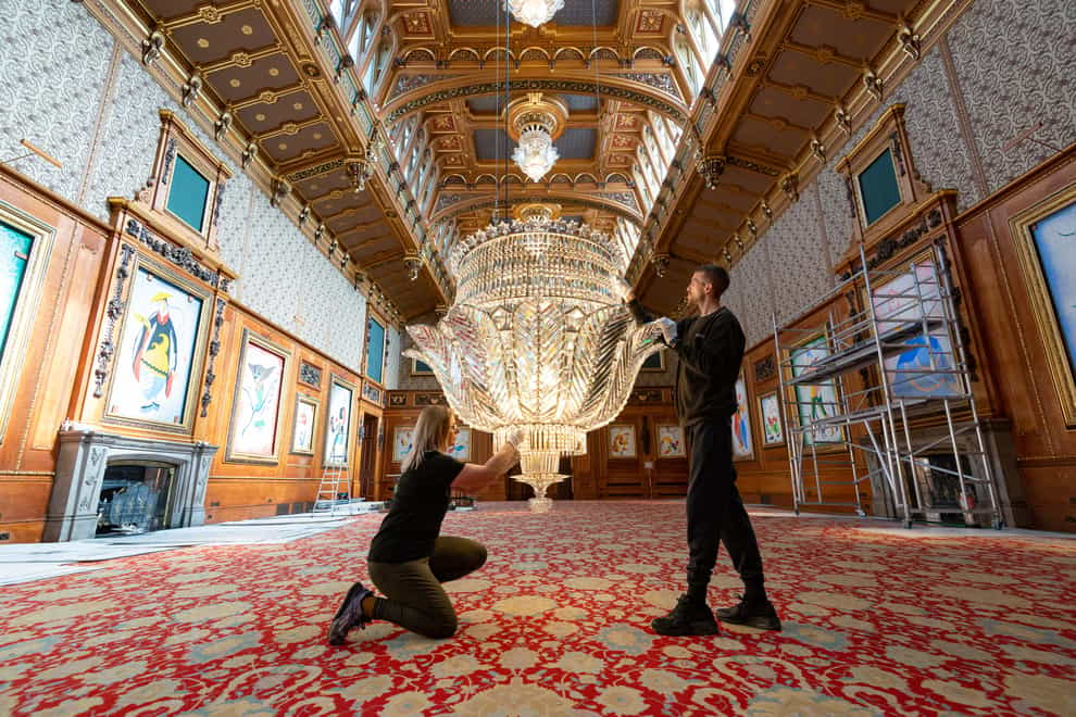 The chandeliers being cleaned in the Waterloo Chamber (Royal Collection Trust/HM Queen Elizabeth II 2022/PA)