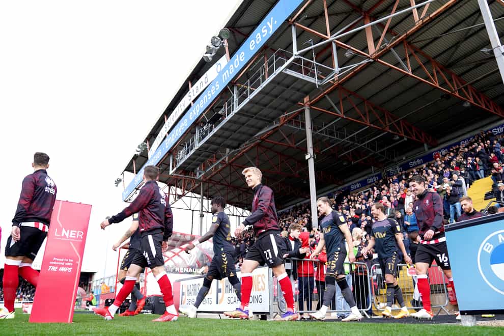 Players at Lincoln’s home ground (Tim Goode/PA)