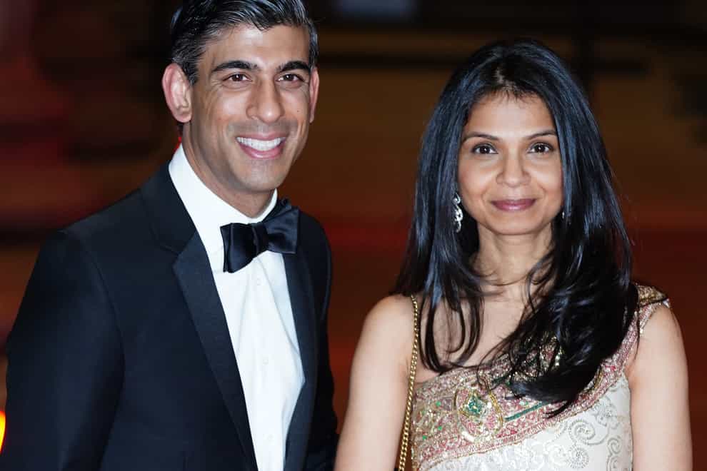 Chancellor Rishi Sunak with his wife Akshata Murthy (Ian West/PA)