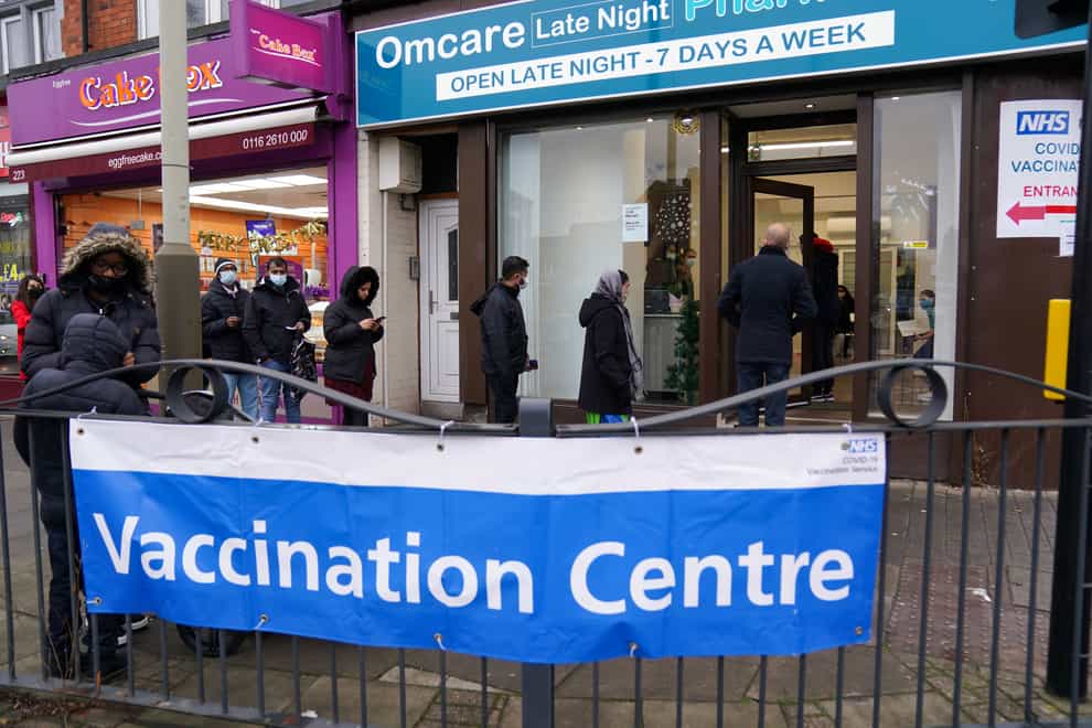 People queue at Melton Road vaccination centre in Leicester in December 2021 (Jacob King/PA)