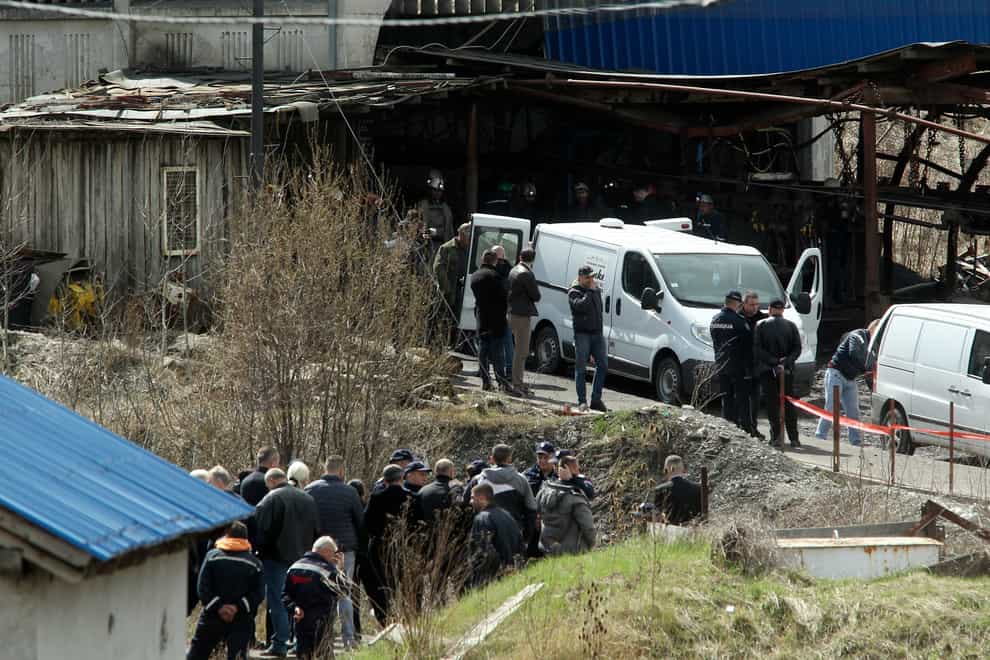 Rescue workers carry a body after a shaft collapsed in Soko coal mine, in central Serbia, Friday, April 1, 2022. An accident in a mine in central Serbia killed eight people and wounded 18. The Soko mine, about 200 kilometers (125 miles) southeast of Belgrade, has had several serious accidents since it started operating in the early 1900s. An accident in the mine in 1998 killed 29 miners. (AP Photo)