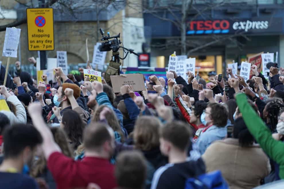 People demonstrate outside Stoke Newington Police Station (Stefan Rousseau/PA)