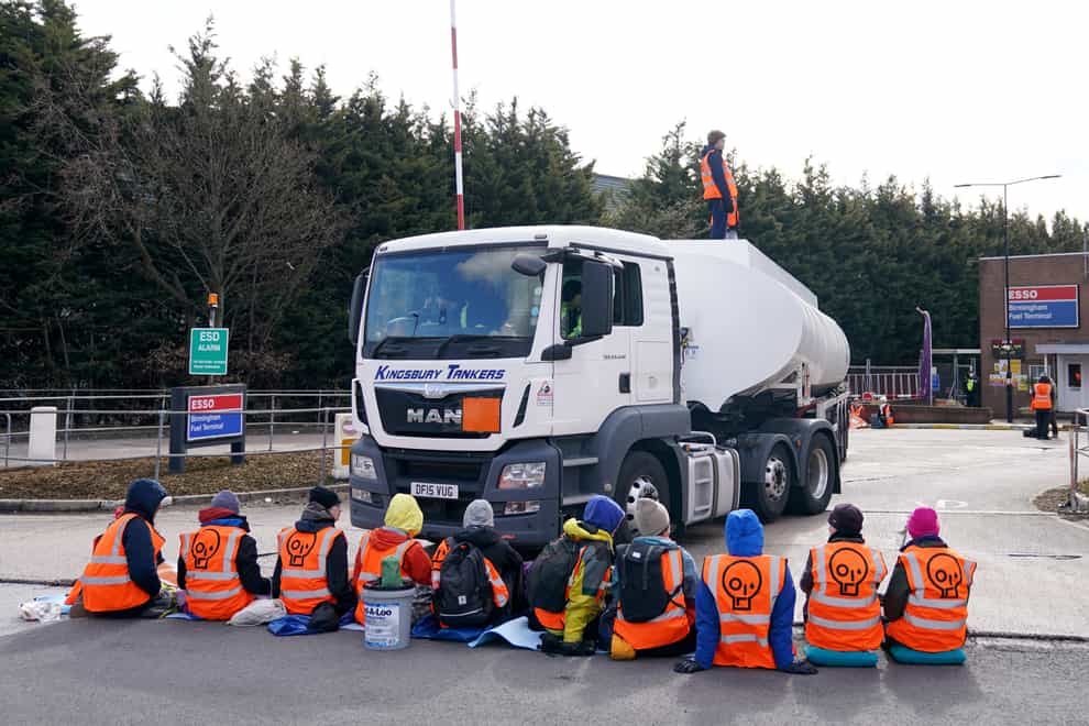 Activists from Just Stop Oil block the route of a tanker as they blockade the Esso Birmingham Fuel Terminal (PA)