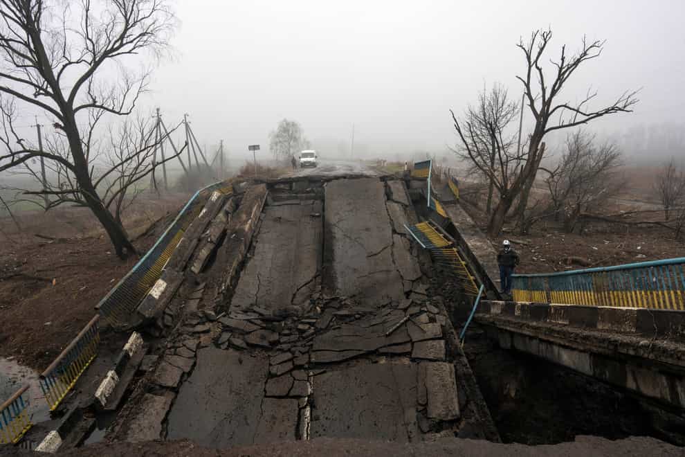 Ukrainian President Volodymyr Zelensky warned his people early on Saturday that retreating Russian forces were creating ‘a complete disaster’ outside the capital as they leave mines across ‘the whole territory,’ even around homes and corpses (Rodrigo Abd/AP)