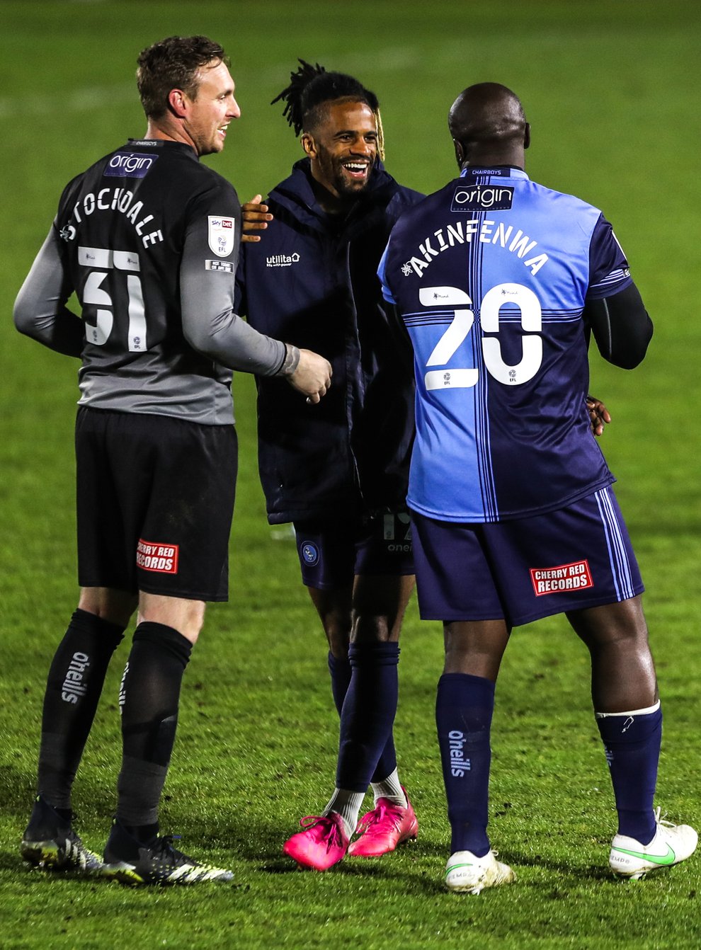 Garath McCleary, centre, was on target as Wycombe honoured Adebayo Akinfenwa, right (Kieran Cleeves/PA)