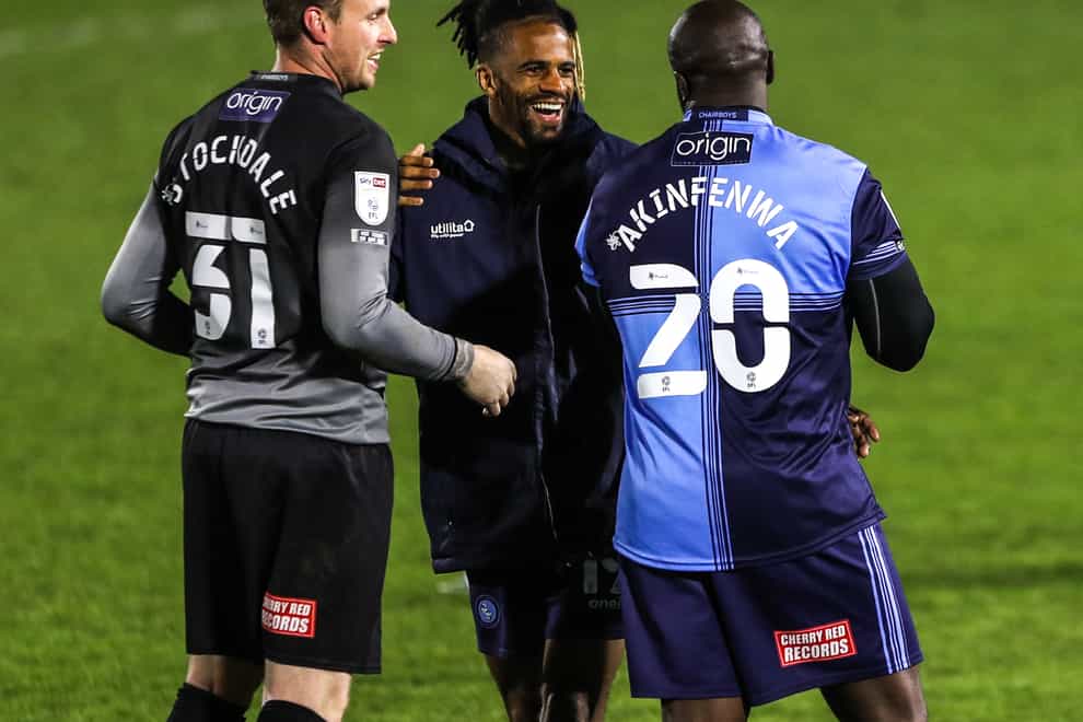 Garath McCleary, centre, was on target as Wycombe honoured Adebayo Akinfenwa, right (Kieran Cleeves/PA)