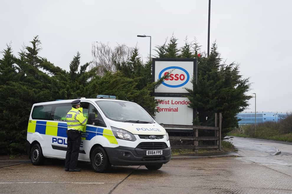 Police presence as activists from Extinction Rebellion blockade Esso West oil facility near Heathrow Airport in London (Steve Parsons/PA)
